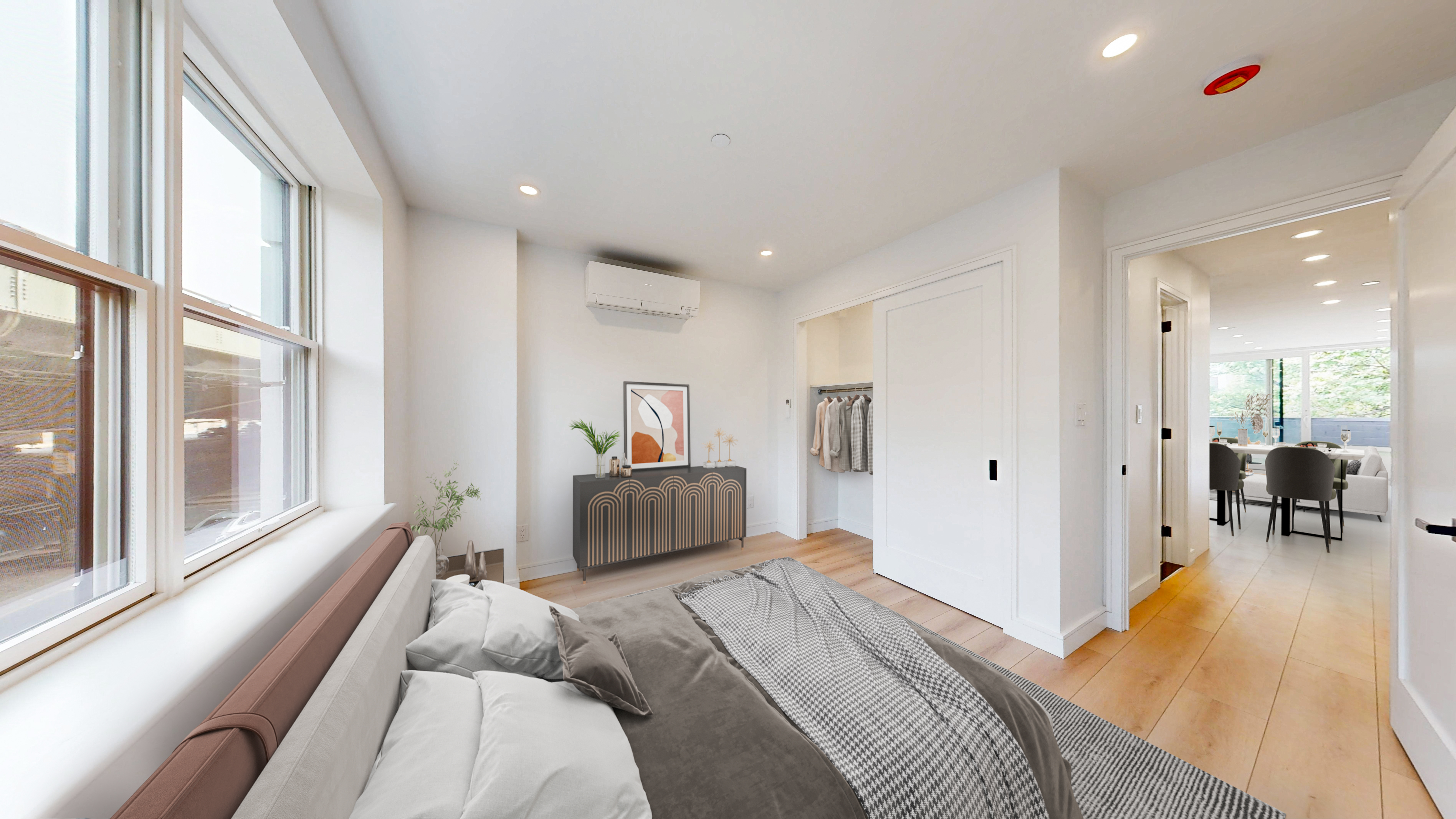 5614 3rd Avenue, Unit 2 Brooklyn, NY 11220 - Photo 6 of 12 a bedroom with a bed and a large window with outer view