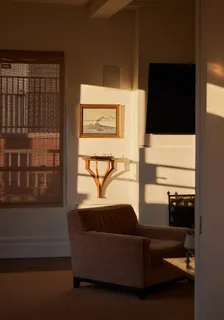 a view of a dining room with furniture and a window