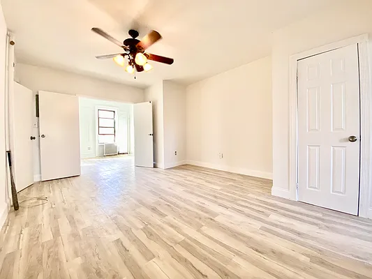 591 Vanderbilt Avenue, Unit 4 Brooklyn, NY 11238 - Photo 2 of 10 a view of an empty room with a ceiling fan