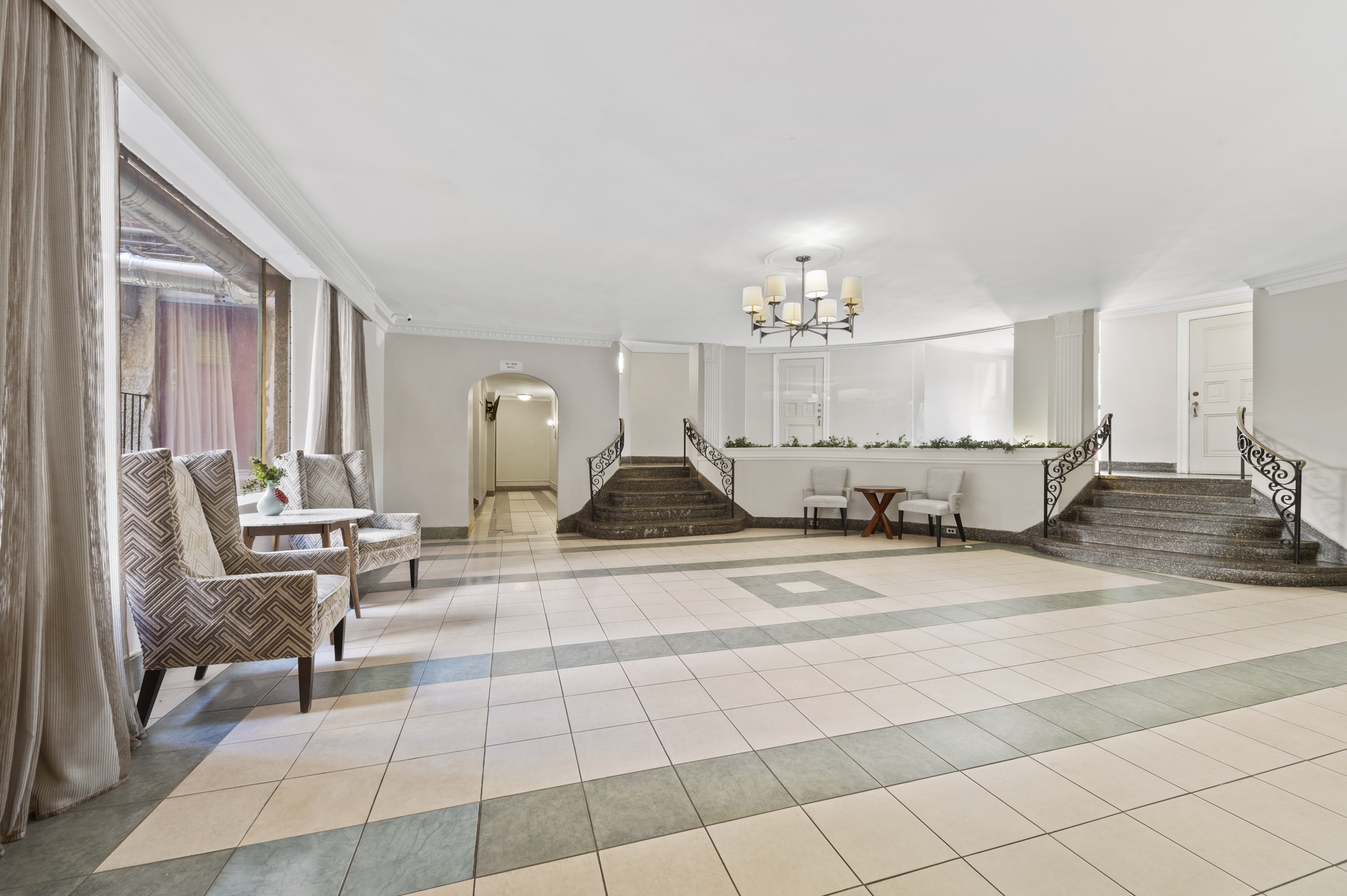 105-05 69th Avenue, Unit 301 Queens, NY 11375 - Photo 11 of 13 a view of a living room and a livingroom with furniture