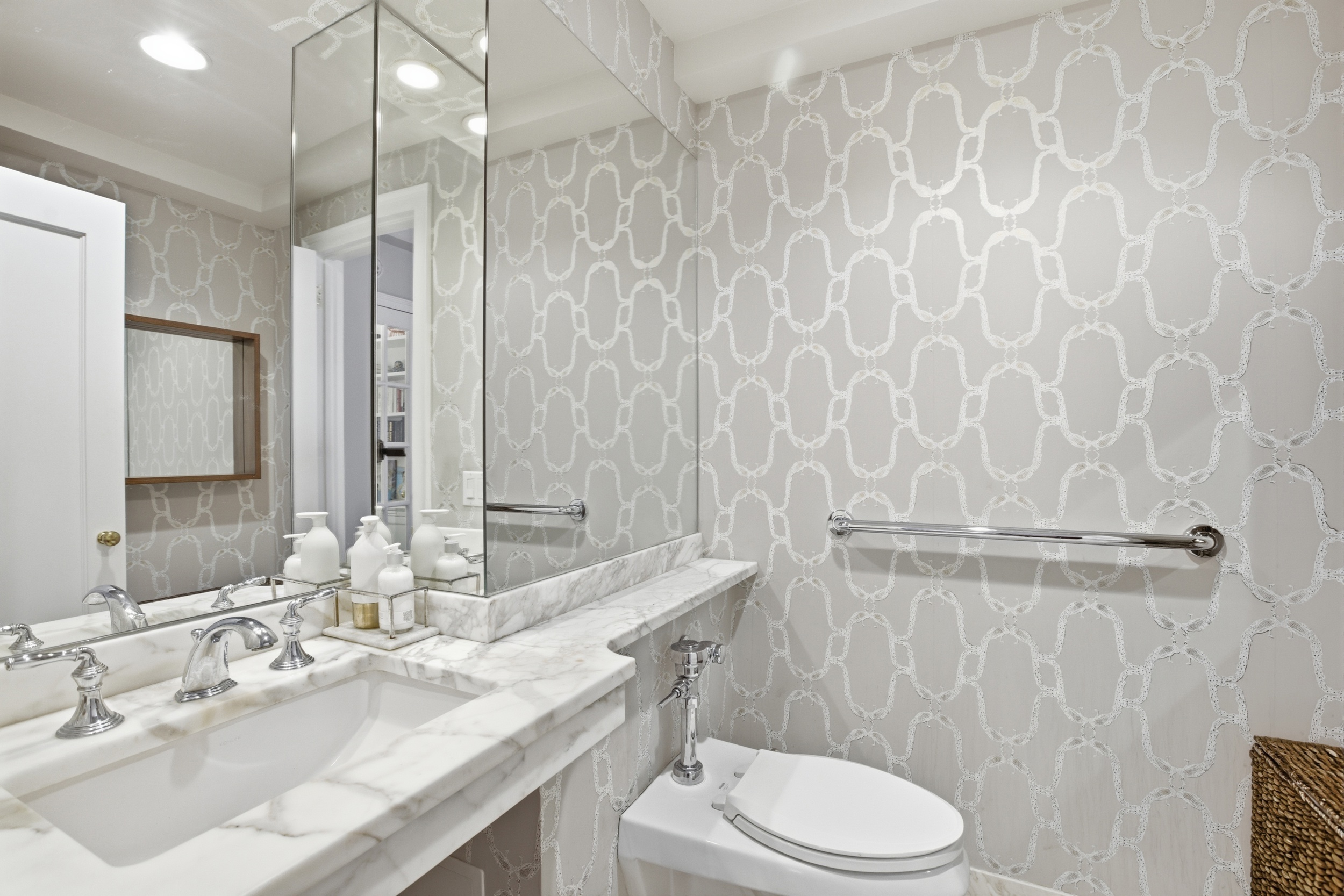 60 Gramercy Park North, Unit 8D Manhattan, NY 10010 - Photo 10 of 14 a bathroom with a granite countertop sink a toilet and a mirror