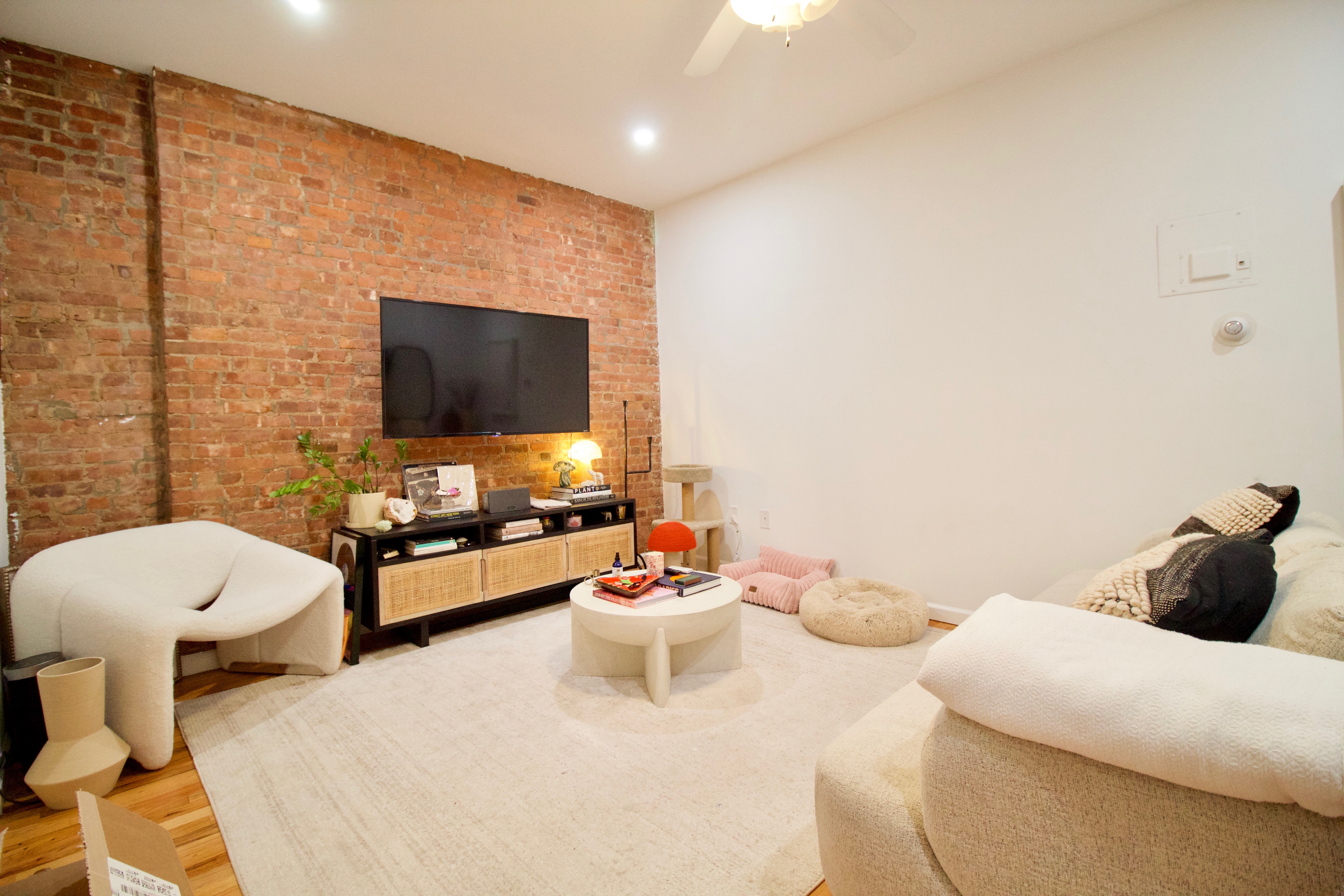 a living room with furniture and a flat screen tv