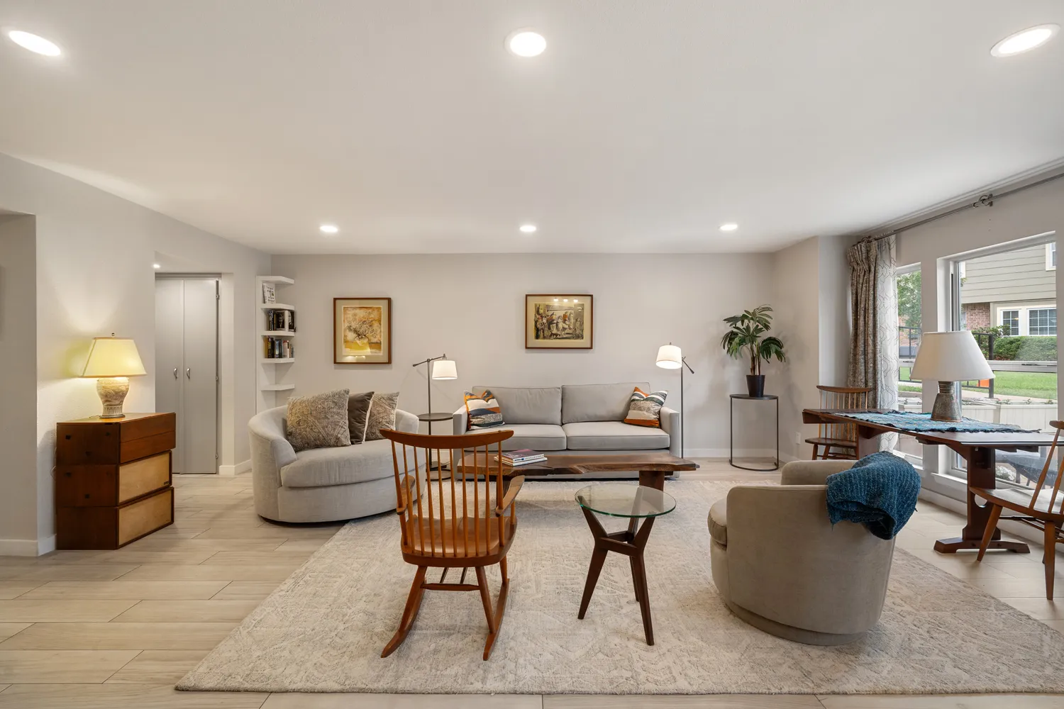 a living room with furniture and a lamp