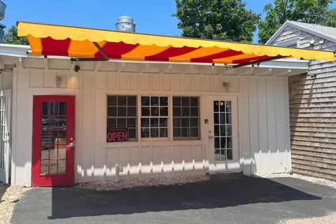 a view of a house with a tub and a fire pit