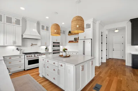 a bathroom with a sink a toilet a shower and a mirror