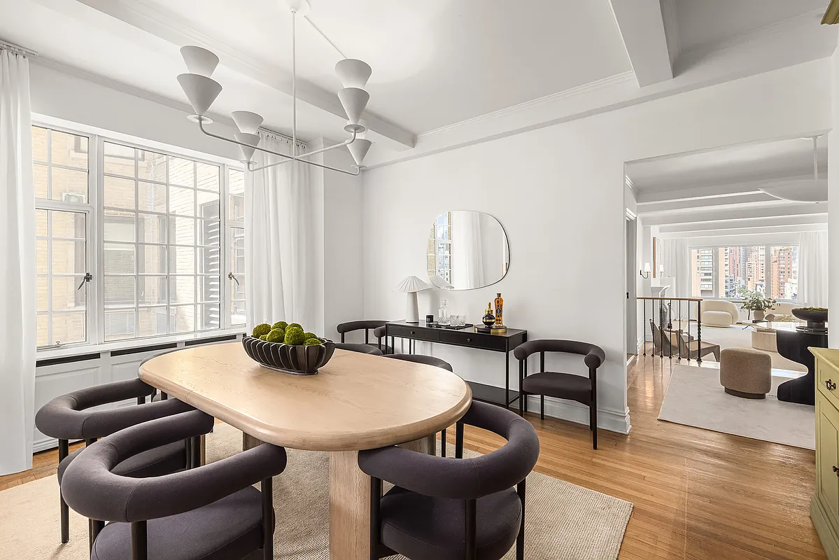 180 East 79th Street, Unit 14B Manhattan, NY 10075 - Photo 5 of 18 a dining room with furniture and wooden floor