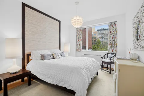 a bedroom with a bed furniture and a window