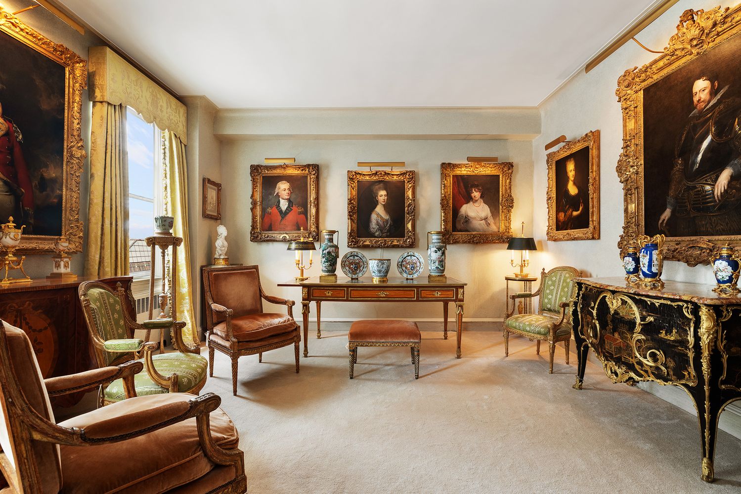a living room with furniture a flat screen tv and a window