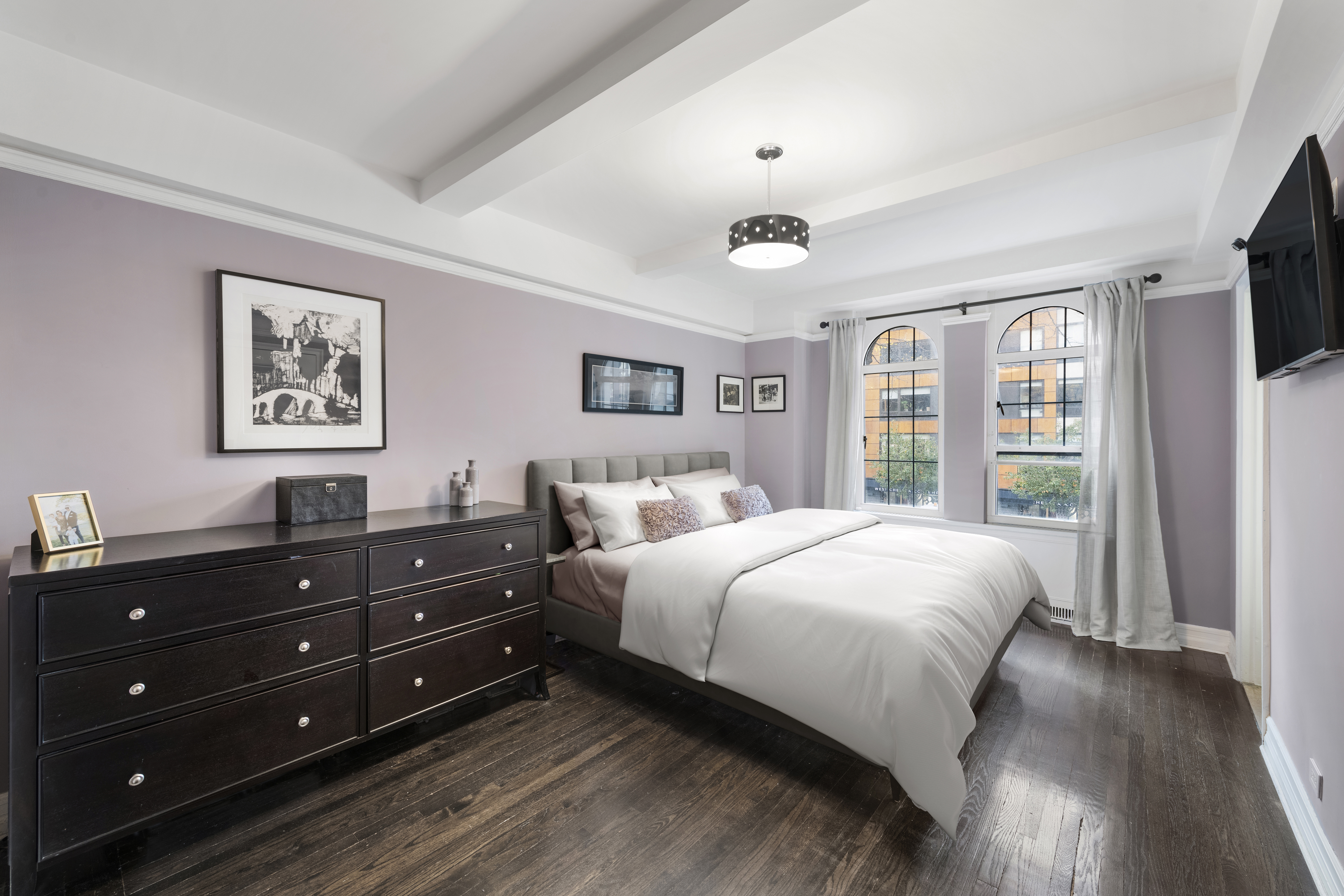 470 West 24th Street, Unit 2C Manhattan, NY 10011 - Photo 7 of 15 a bedroom with a bed window and a television
