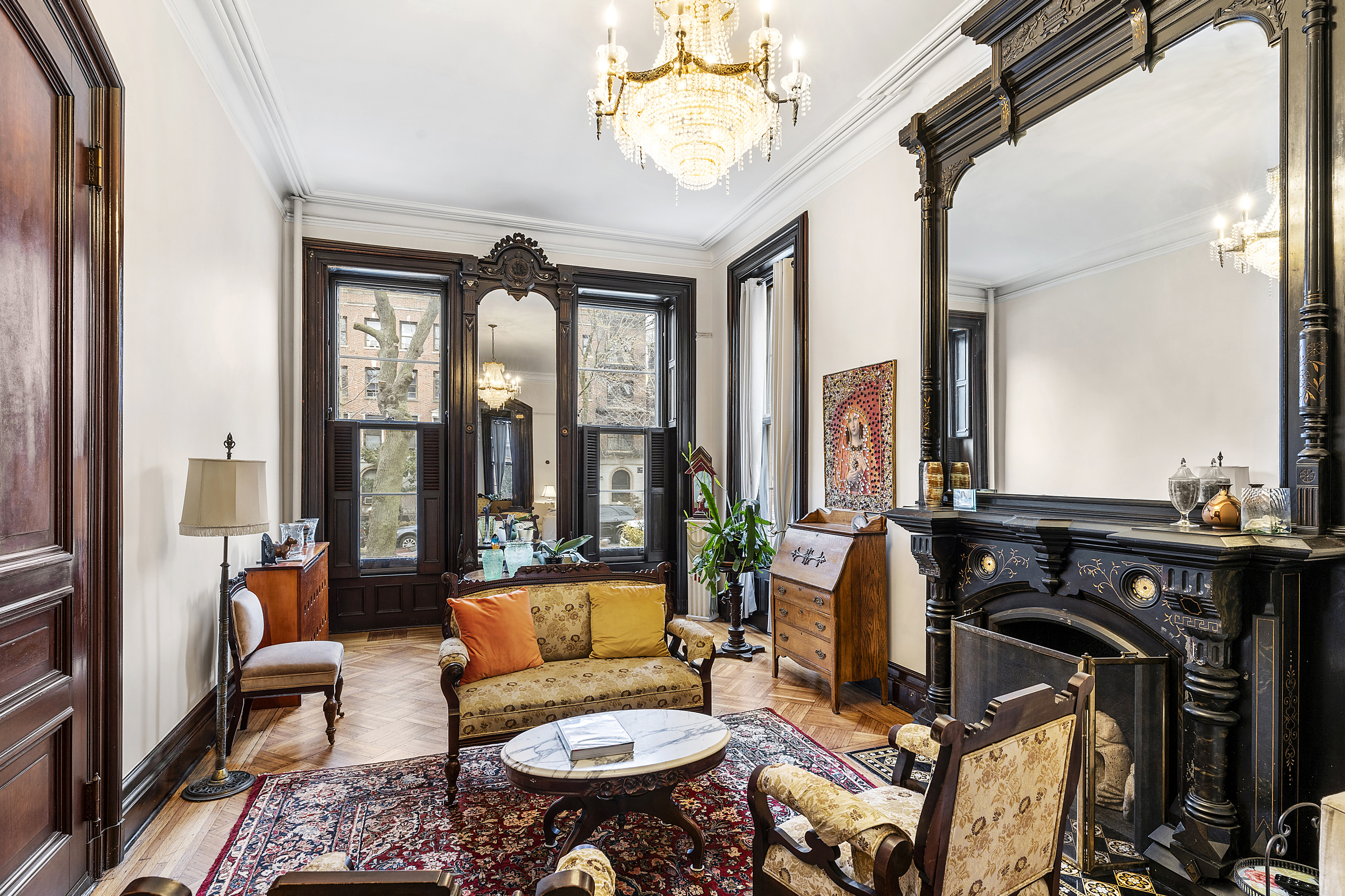 419 Clinton Avenue Brooklyn, NY 11238 - Photo 2 of 19 a living room with furniture a rug and a floor to ceiling window