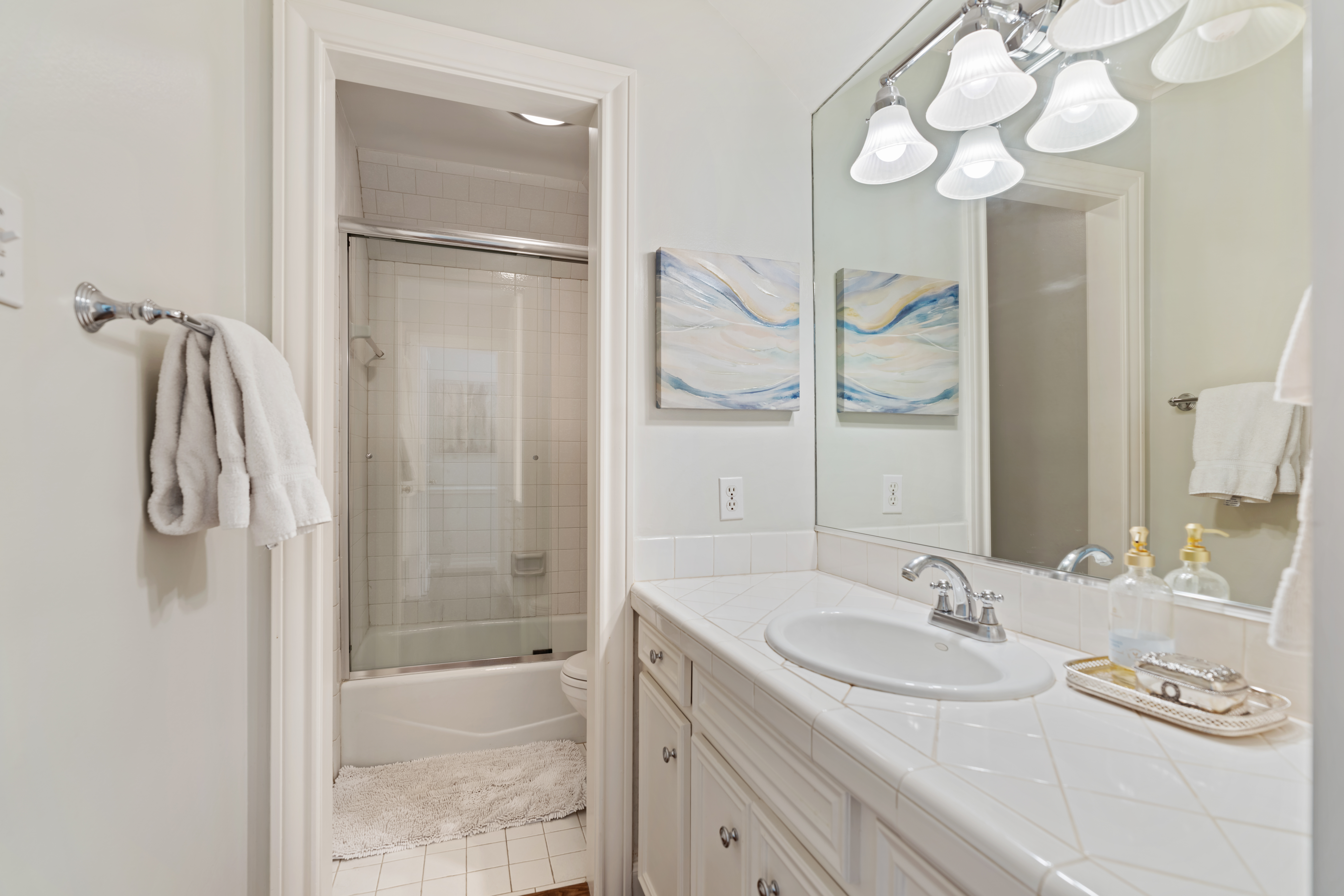 711 Pifer Road Houston, TX 77024 - Photo 38 of 53 a bathroom with a granite countertop sink a mirror and shower