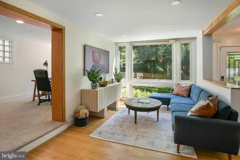 a living room with furniture and a large window