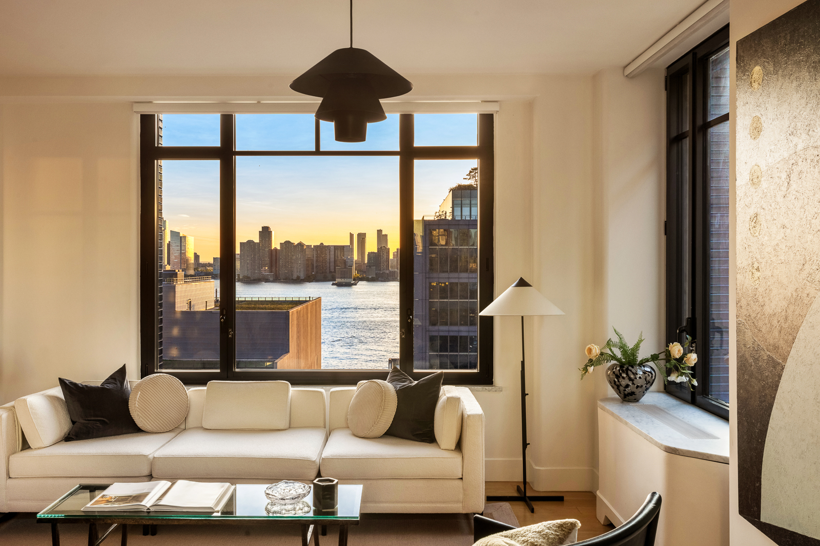 110 Charlton Street, Unit 17E Manhattan, NY 10014 - Photo 3 of 20 a living room with furniture and a large window