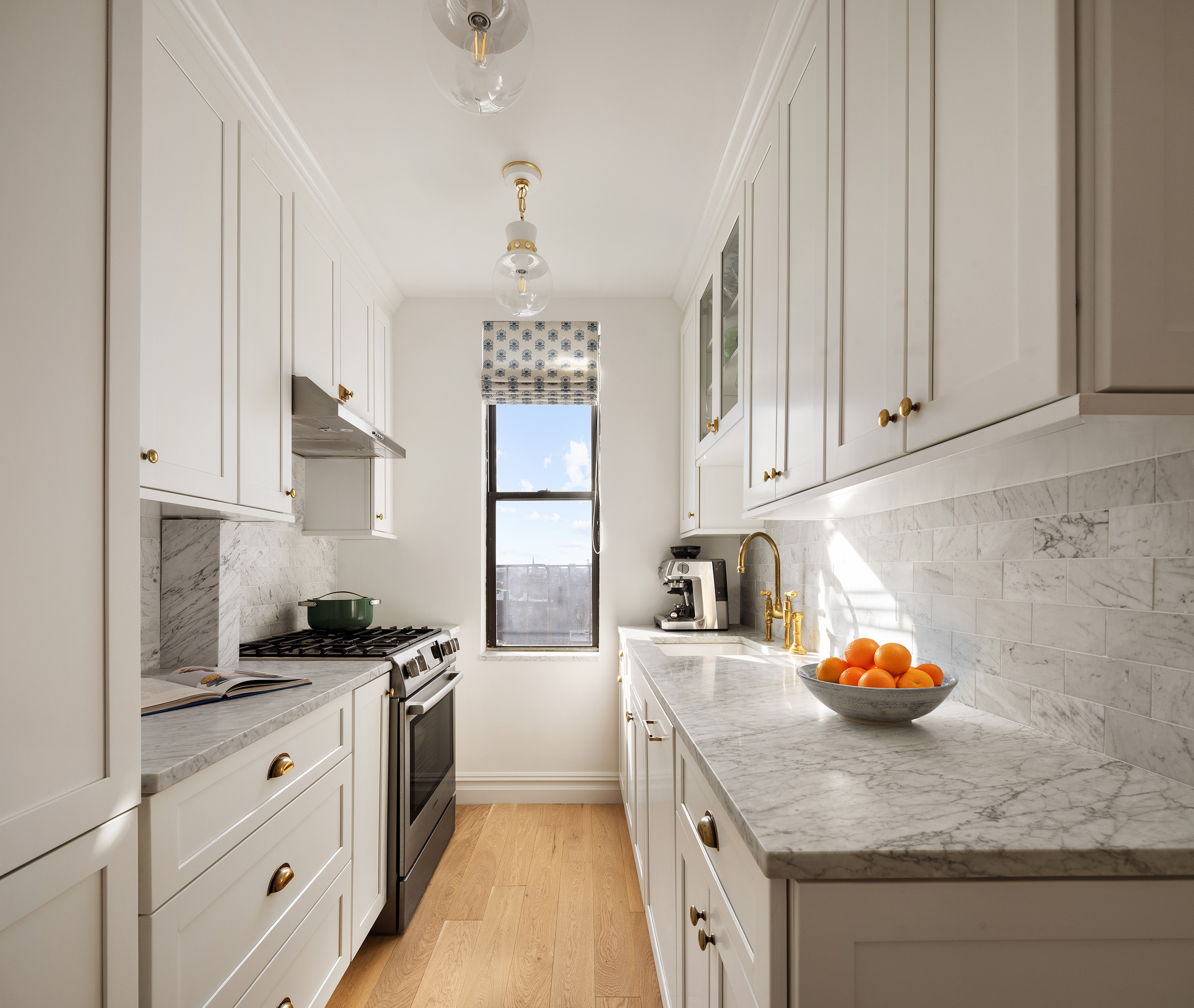 2 Grace Court, Unit 6E Brooklyn, NY 11201 - Photo 5 of 11 a kitchen with stainless steel appliances granite countertop a sink dishwasher a stove a refrigerator white cabinets and wooden floor