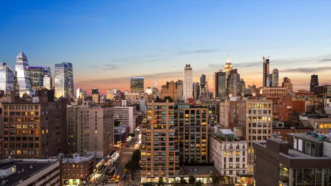 a view of a city with tall buildings