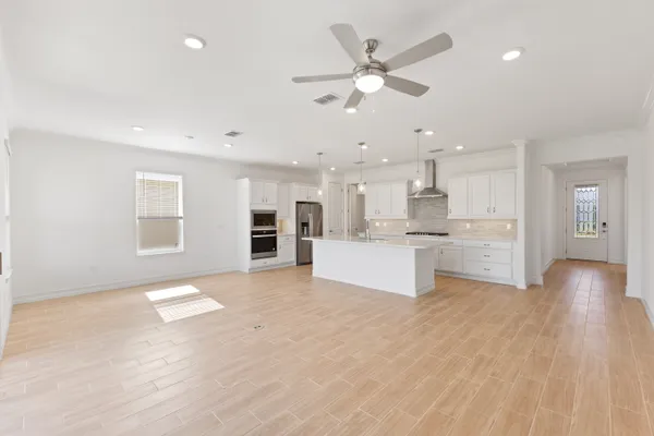 a view of kitchen with cabinets and wooden floor