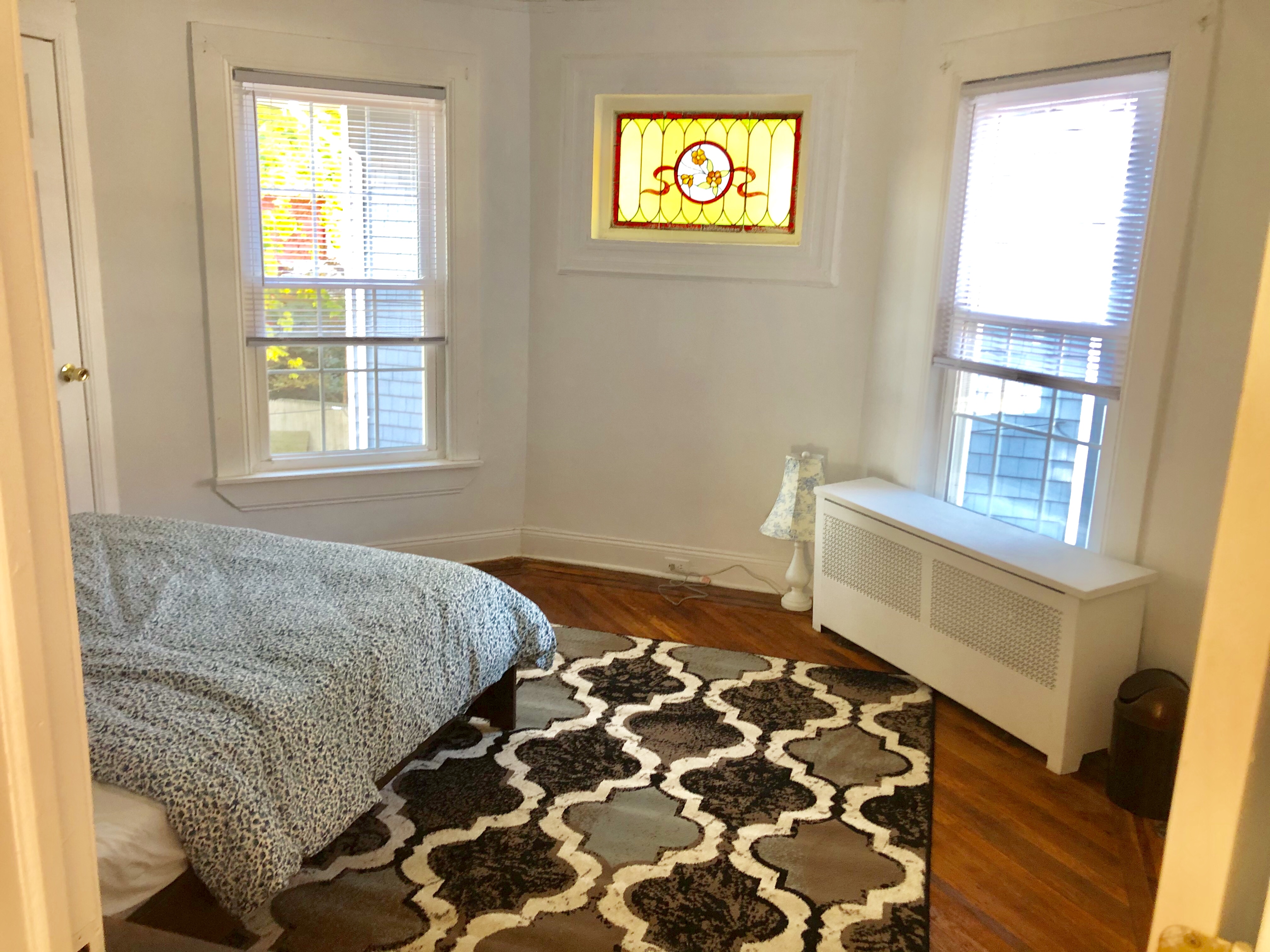 1112 Beverley Road Brooklyn, NY 11218 - Photo 46 of 53 a bedroom with a bed and a window