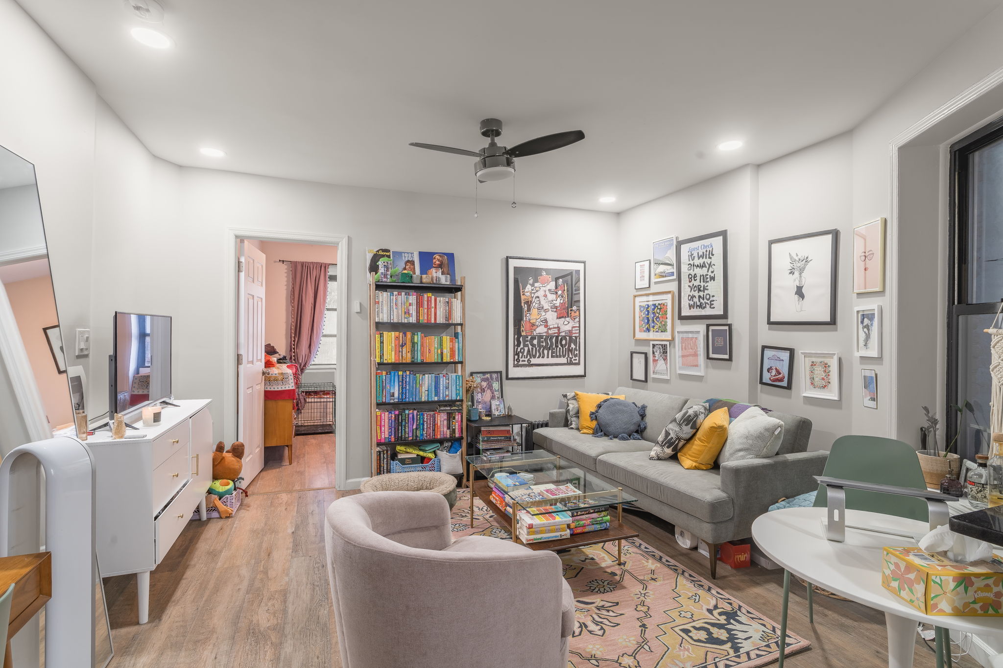 43 Underhill Avenue, Unit B2 Brooklyn, NY 11238 - Photo 4 of 10 a living room with furniture and a book shelf