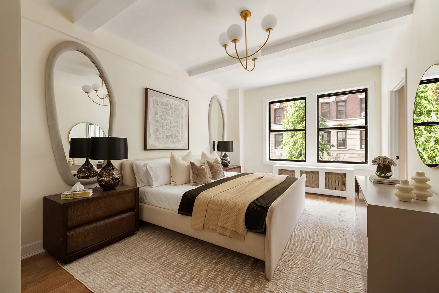 a bedroom with a bed a couch and dresser