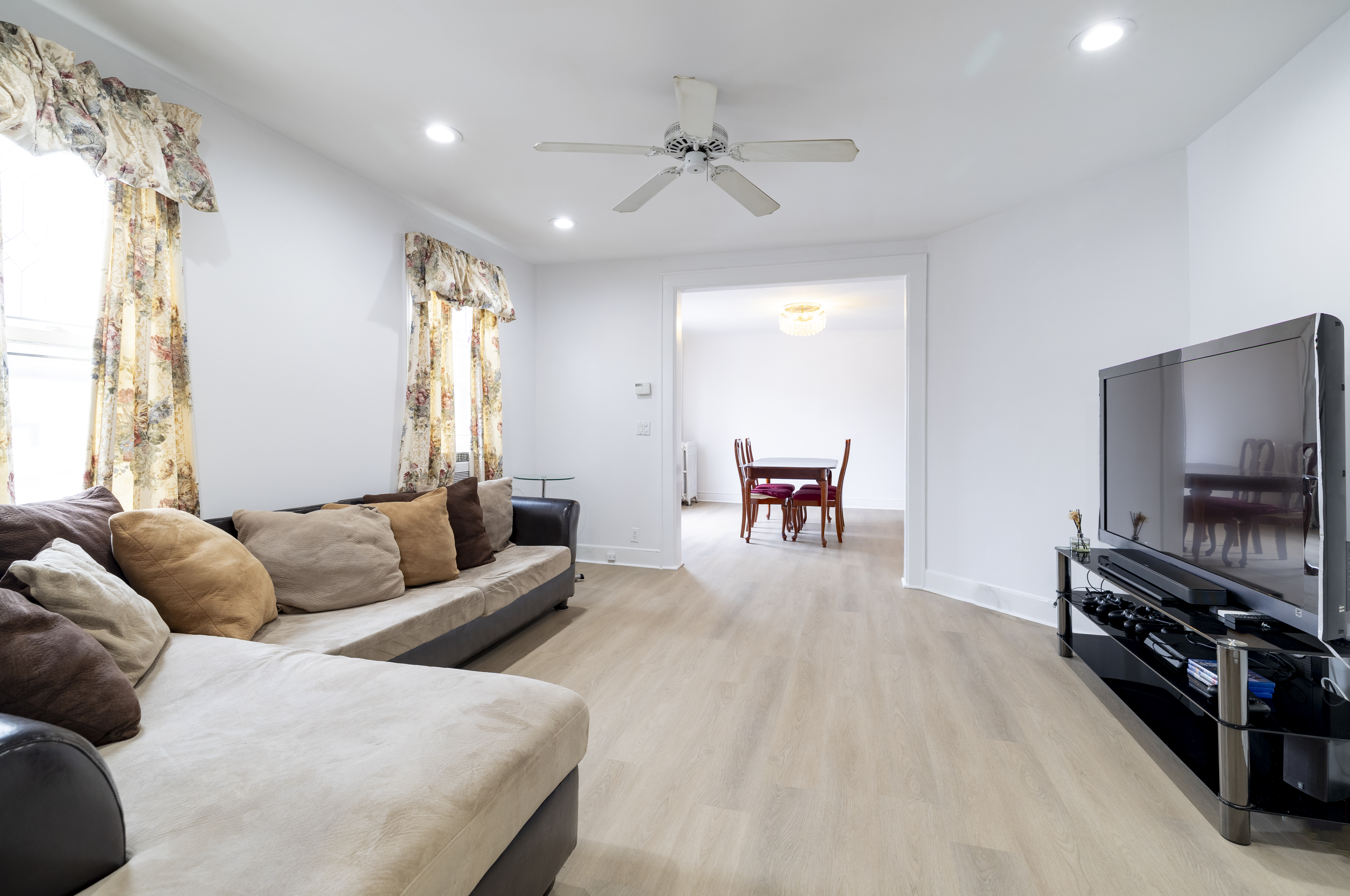 87-46 89th Street Queens, NY 11421 - Photo 3 of 25 a living room with furniture and a flat screen tv