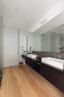 a room with a bed and a sink