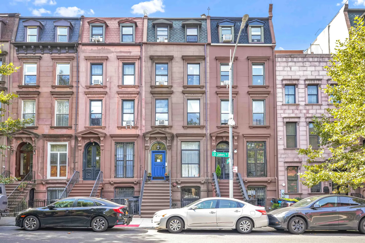 a car parked in front of a brick building