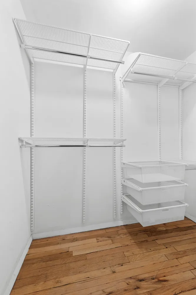 a view of an empty walk in closet