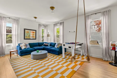 a bedroom with furniture and a window