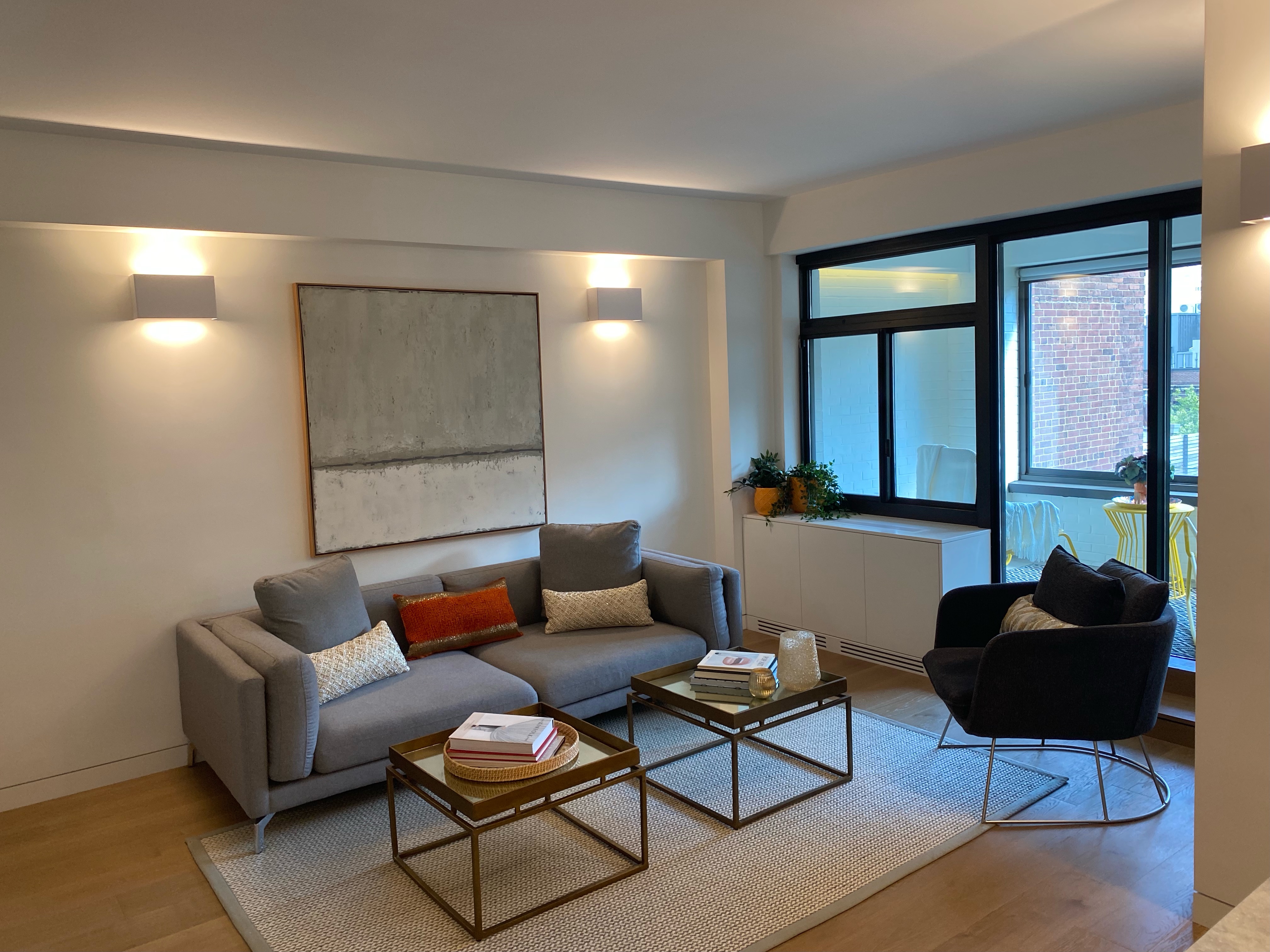 124 East 79th Street, Unit 7D Manhattan, NY 10075 - Photo 2 of 25 a living room with furniture and a potted plant