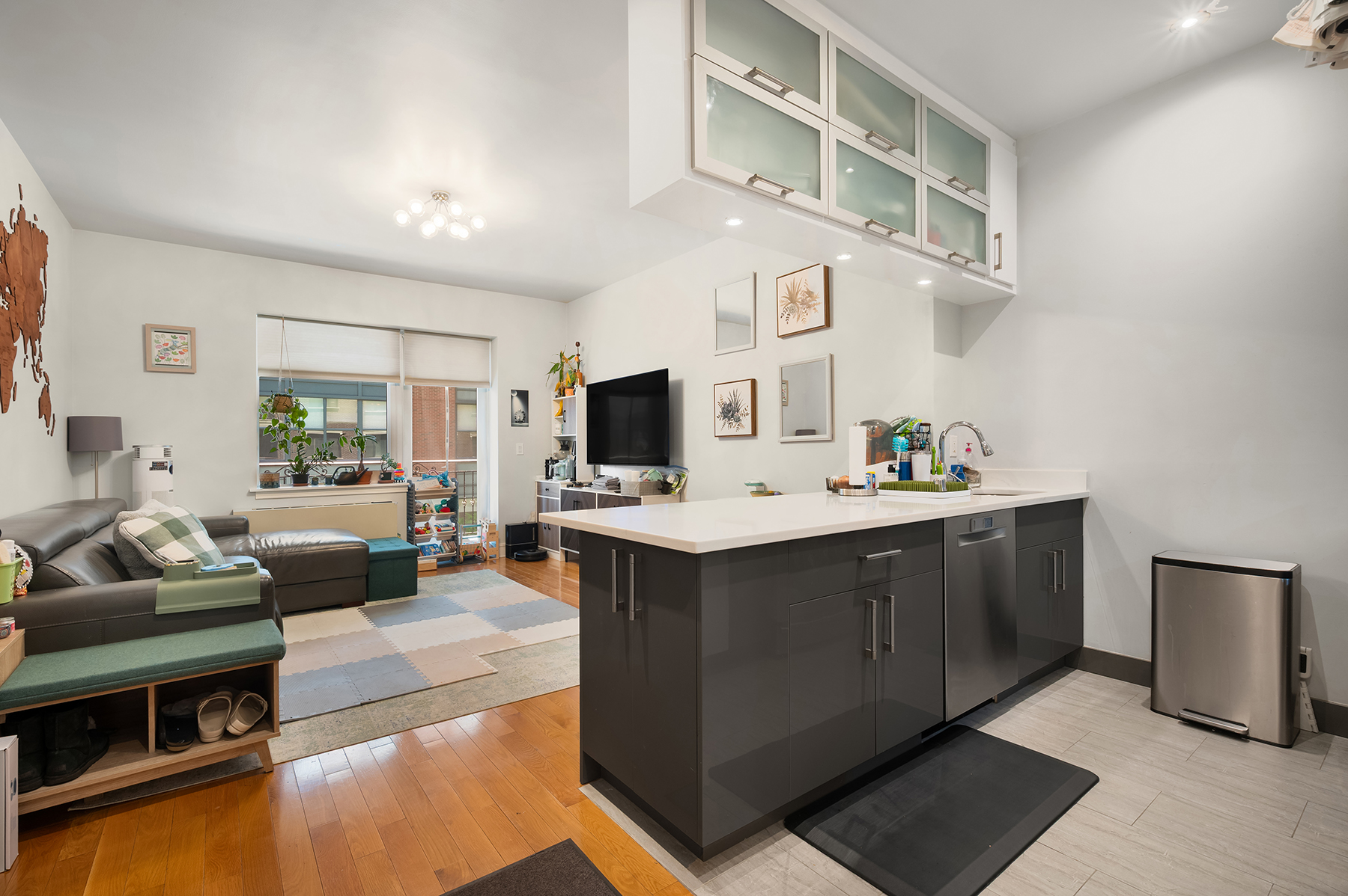 a kitchen with stainless steel appliances kitchen island granite countertop a sink and cabinets