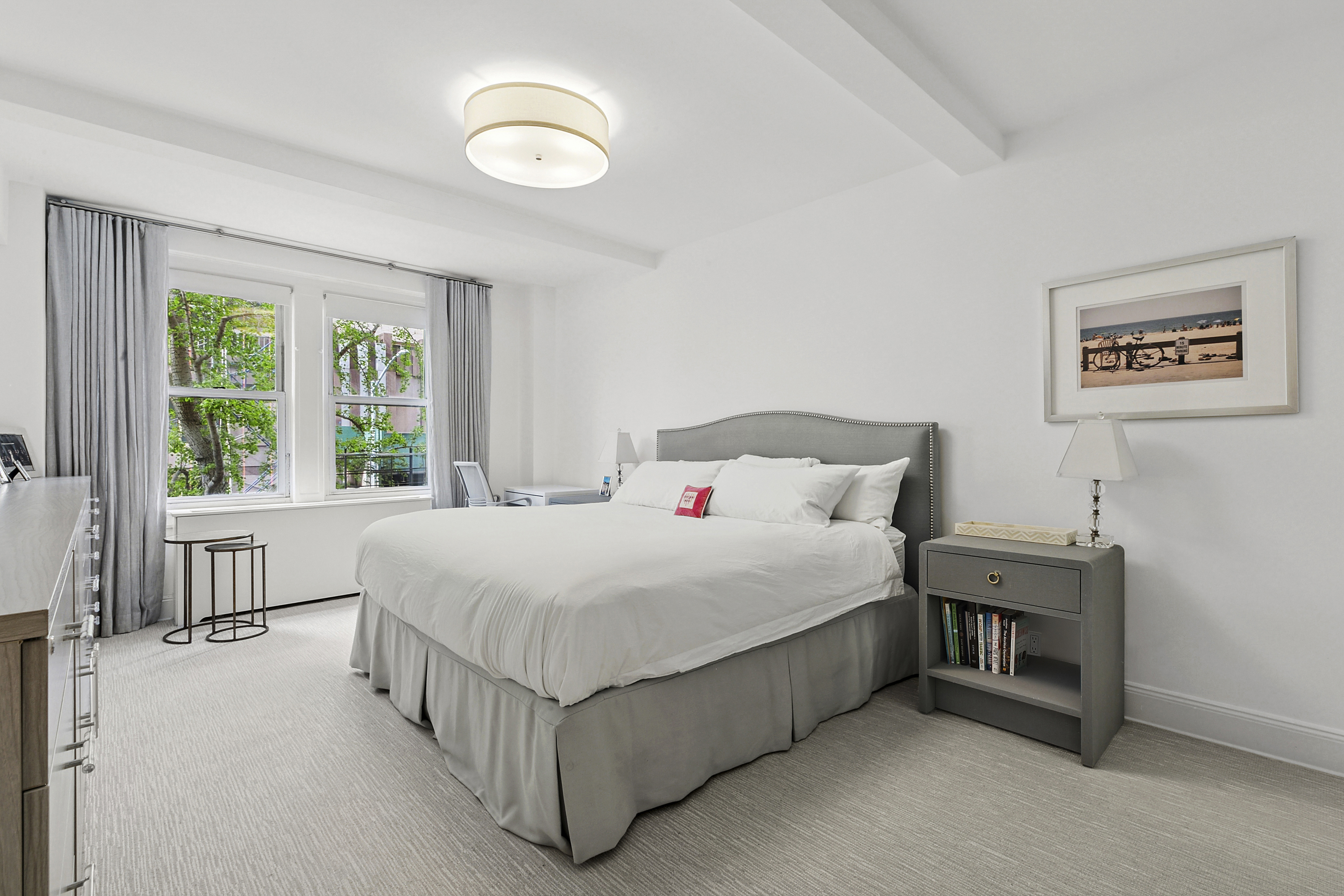 205 East 69th Street, Unit 3A Manhattan, NY 10021 - Photo 5 of 11 a spacious bedroom with a bed and a window