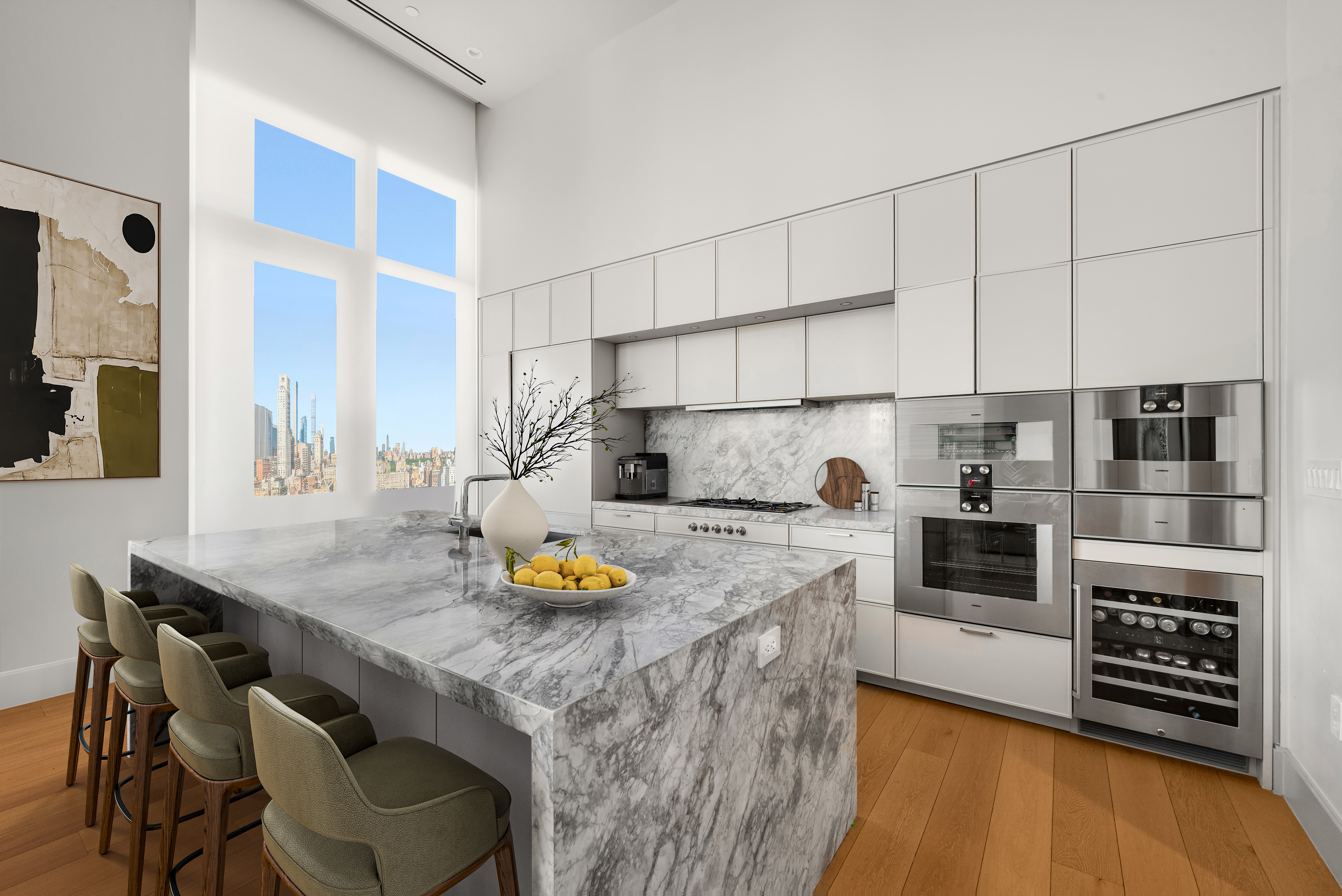 1059 3rd Avenue, Unit 25 Manhattan, NY 10065 - Photo 3 of 13 a kitchen with stainless steel appliances a stove a sink and a refrigerator