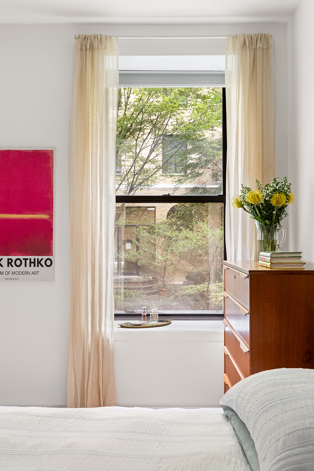 295 St Johns Place, Unit 1C Brooklyn, NY 11238 - Photo 9 of 17 a living room with a large window and a bed