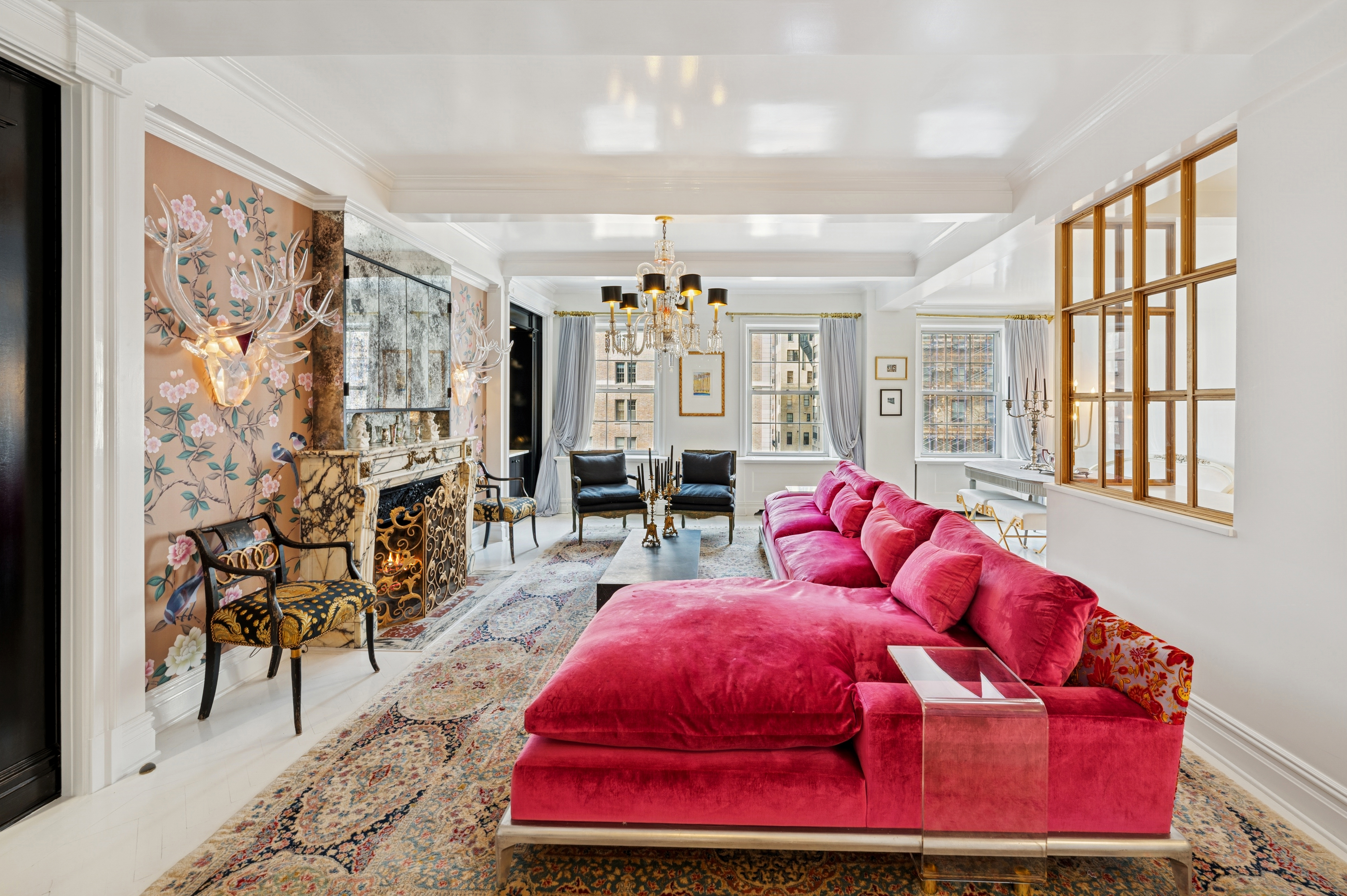 891 Park Avenue, Unit 10 Manhattan, NY 10075 - Photo 5 of 27 a living room with furniture and chandelier