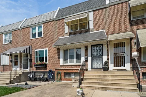 a front view of a house with a outdoor space