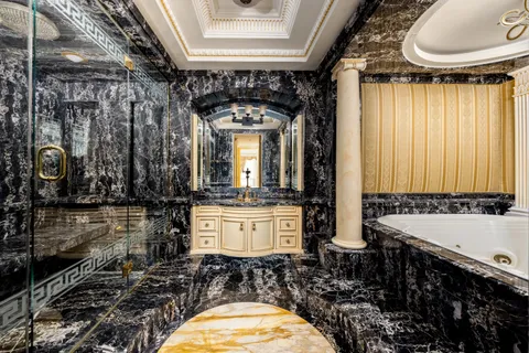 a bathroom with a sink a mirror and a toilet