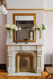 a view of living room with furniture and large windows