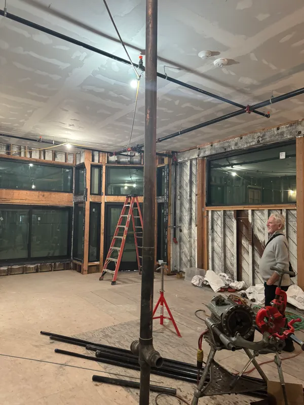 a view of a room with wooden floor