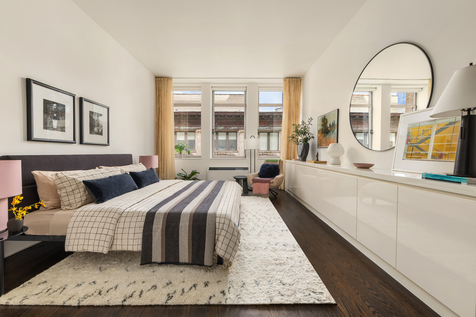 252 7th Avenue, Unit 14G Manhattan, NY 10001 - Photo 7 of 20 a spacious bedroom with a bed couch and a large window