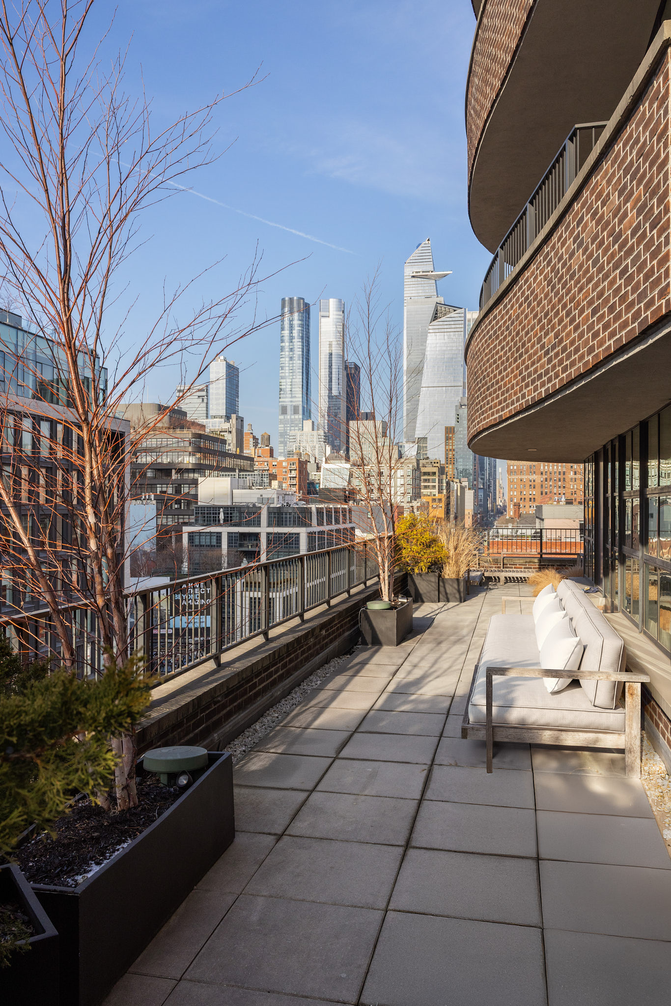 456 West 19th Street, Unit PHH Manhattan, NY 10011 - Photo 17 of 21 a view of a patio with table and chairs and potted plants
