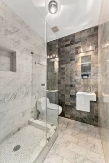 a bathroom with a shower and a bathtub