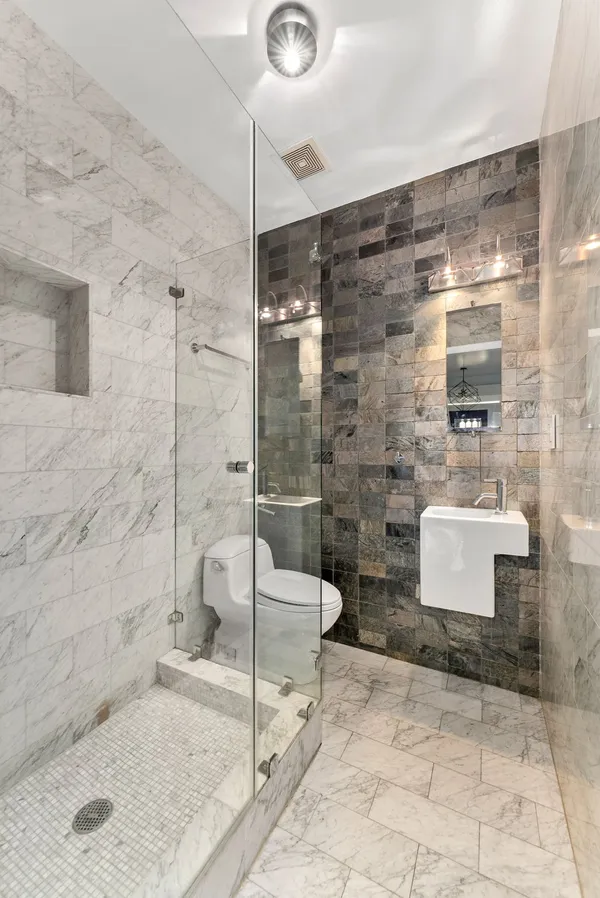 a bathroom with a shower and a bathtub