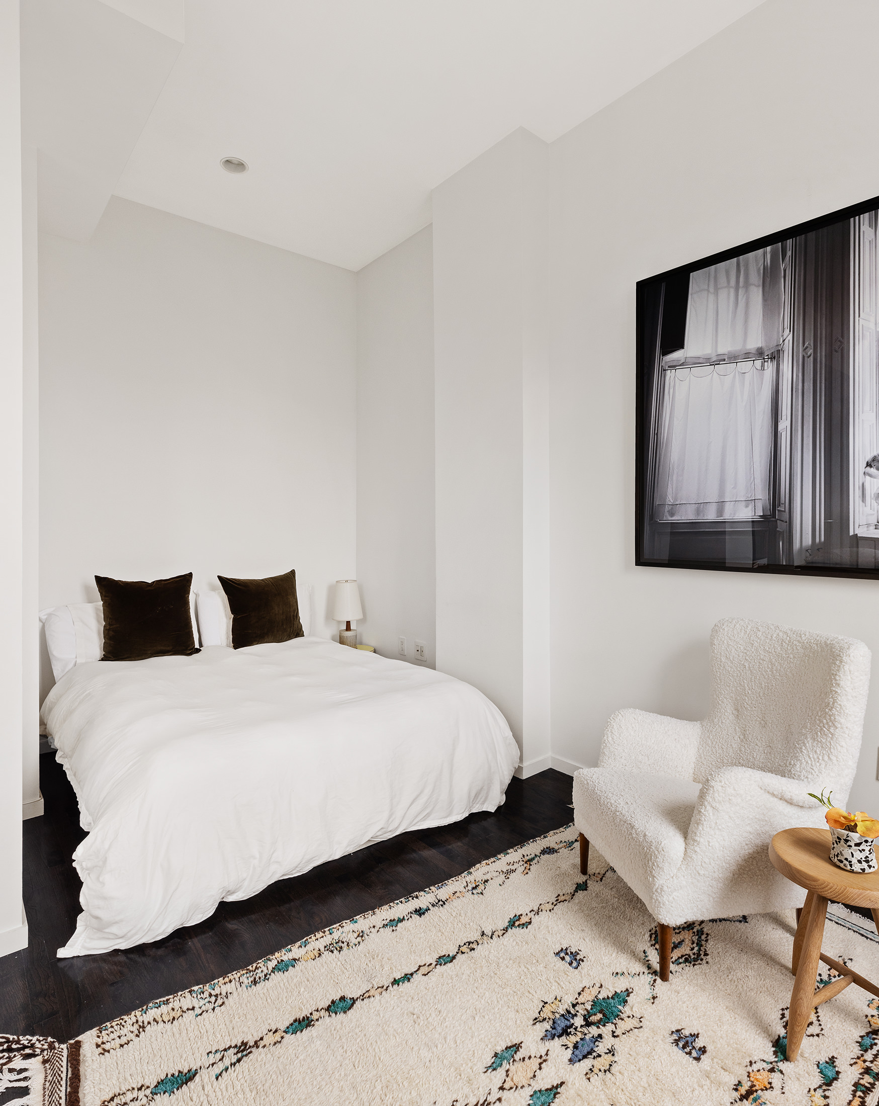 175 East Broadway, Unit 6A Manhattan, NY 10002 - Photo 4 of 11 a bedroom with a bed and wooden floor