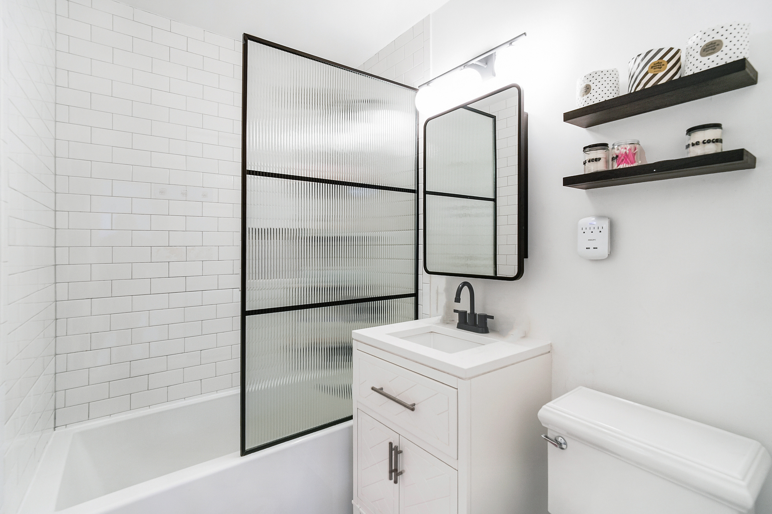 330 3rd Avenue, Unit 15G Manhattan, NY 10010 - Photo 10 of 14 a bathroom with a sink toilet and shower