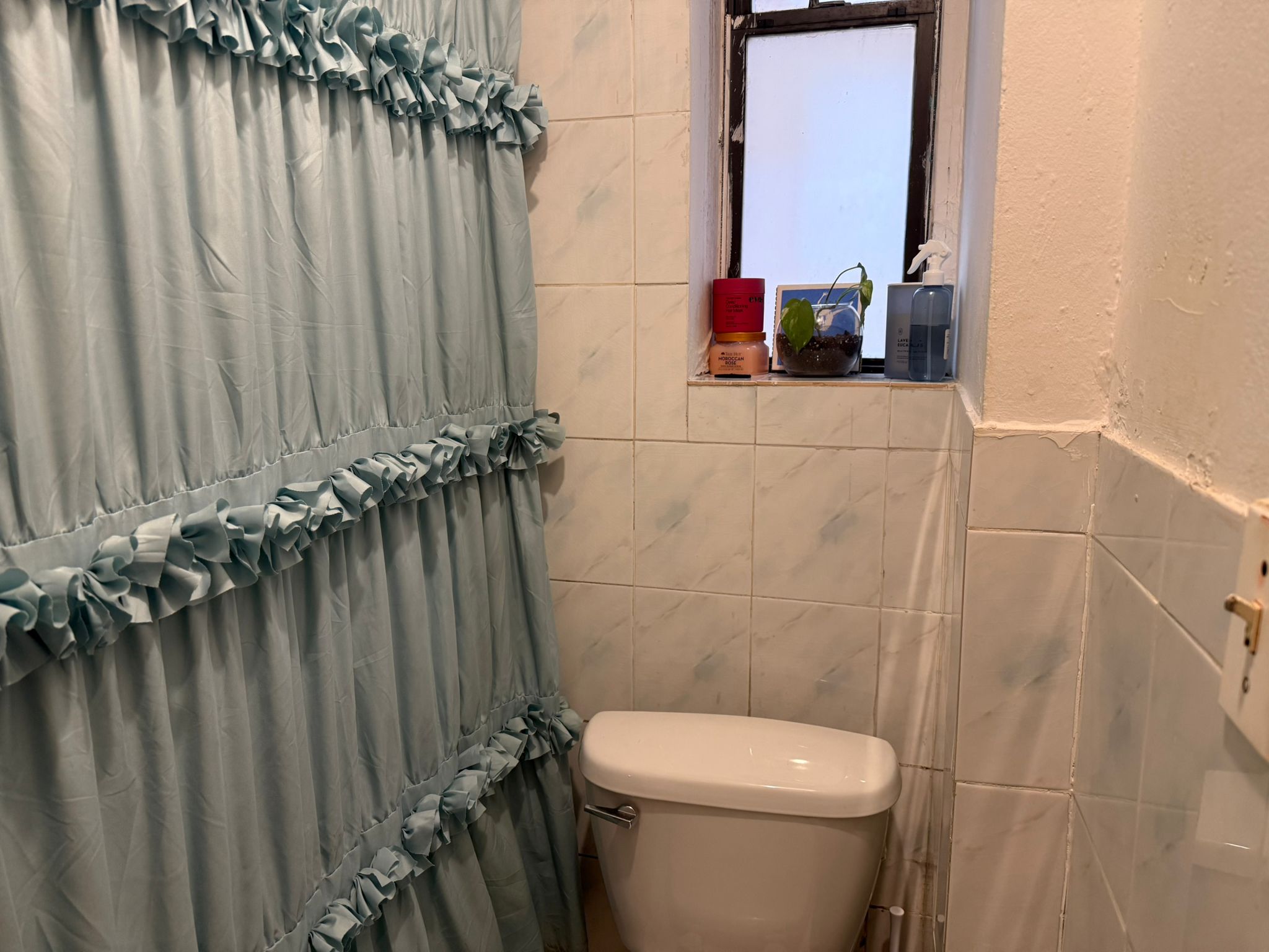 1278 1st Avenue, Unit 2 Manhattan, NY 10065 - Photo 17 of 19 a bathroom with a sink a toilet and shower