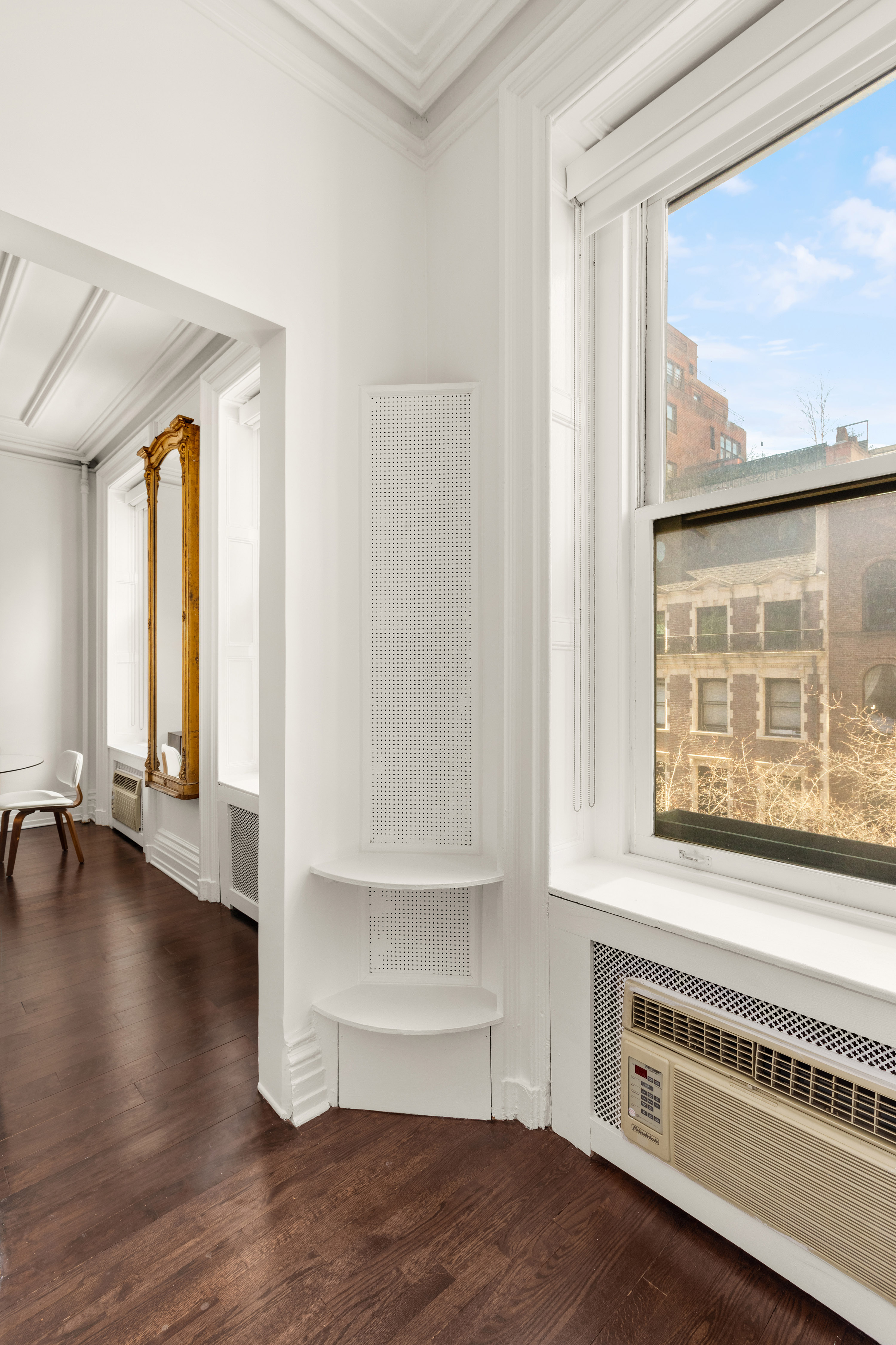 111 East 36th Street, Unit 4A Manhattan, NY 10016 - Photo 11 of 19 a view of an empty room with a window and wooden floor