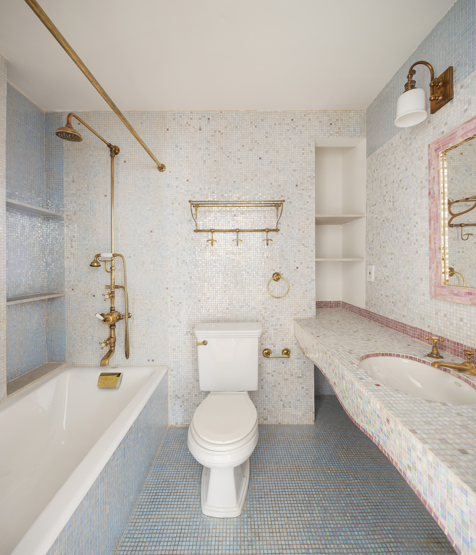 60 Warren Street, Unit 2 Manhattan, NY 10007 - Photo 14 of 16 a bathroom with a granite countertop sink a toilet and bathtub
