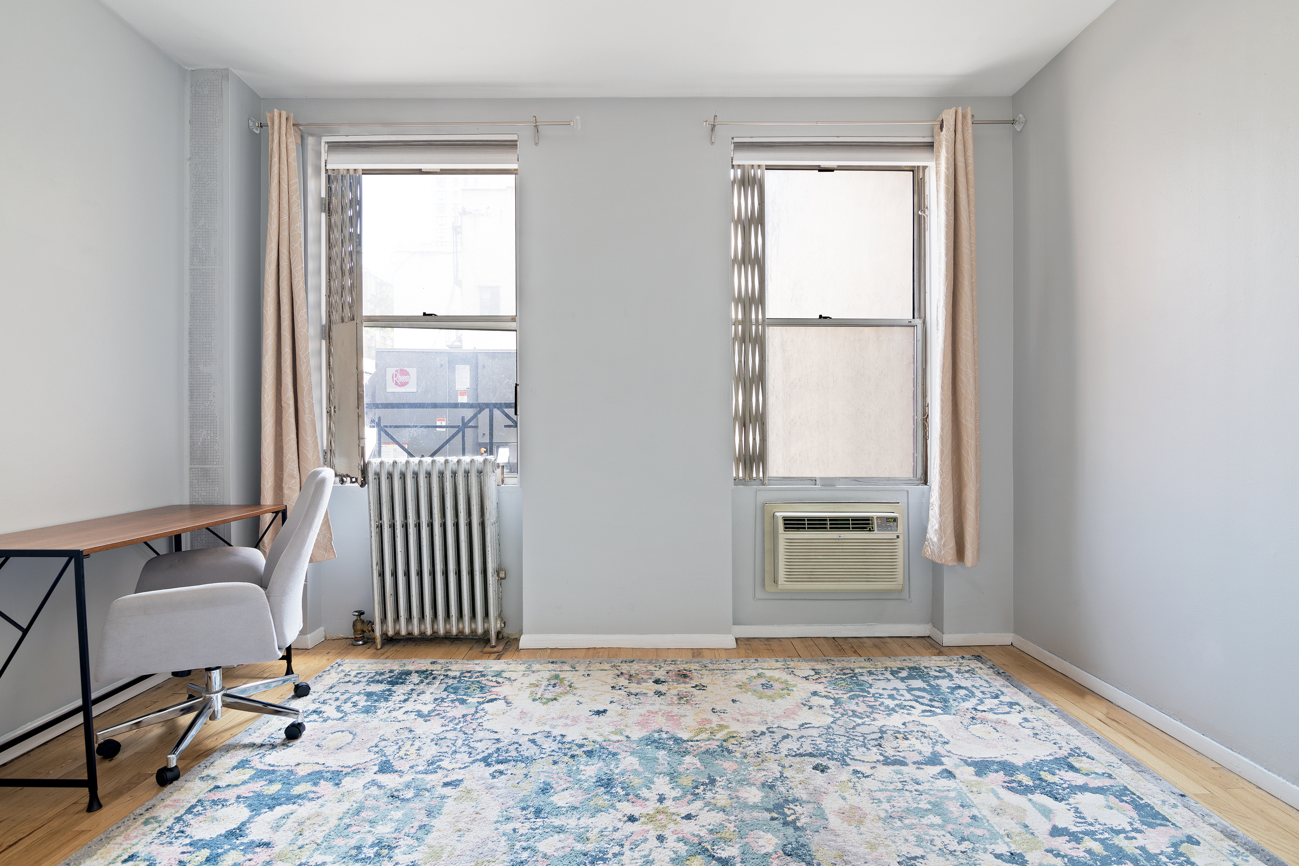 a view of a room with a window and gate