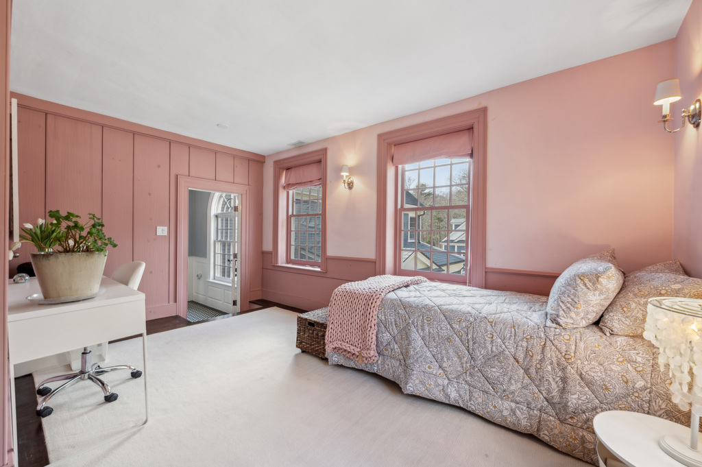 79 Pine Street Dover, MA 02030 - Photo 15 of 25 a bedroom with a bed and a potted plant