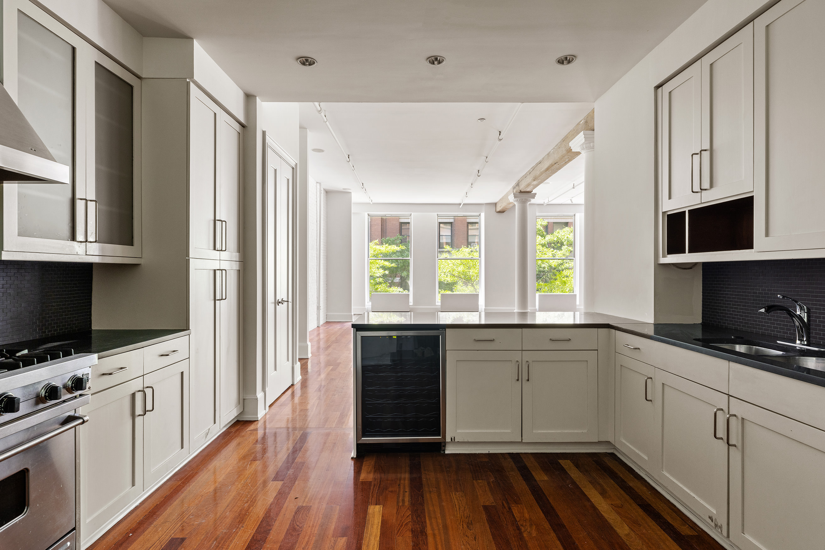 285 Lafayette Street, Unit 2B Manhattan, NY 10012 - Photo 6 of 19 a kitchen with a sink a window and appliances